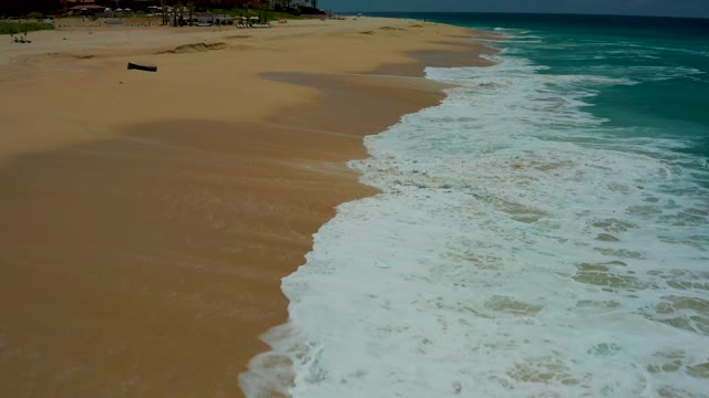 DREAMS LOS CABOS BCS MEXICO-2021: Waves Rolling Onto Sandy Beach From Above