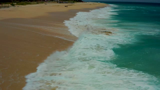 DREAMS LOS CABOS BCS MEXICO-2021: Waves Rolling Onto Sandy Beach Shoreline