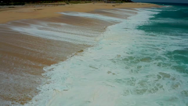 DREAMS LOS CABOS BCS MEXICO-2021: Waves Advancing and Receding on Sandy Shore