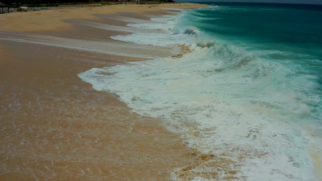 DREAMS LOS CABOS BCS MEXICO-2021: Waves Crashing and Receding on Sandy Beach Aerial