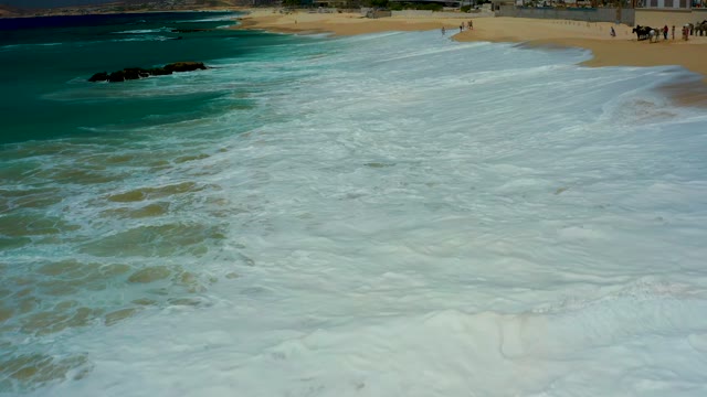 DREAMS LOS CABOS BCS MEXICO-2021: Waves Crashing and Receding on Sandy Beach