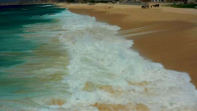 DREAMS LOS CABOS BCS MEXICO-2021: Ocean Waves Breaking on Sandy Shore