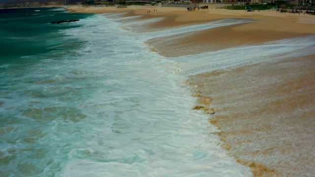 DREAMS LOS CABOS BCS MEXICO-2021: Waves Advancing and Receding on Sandy Beach