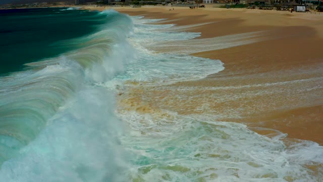 DREAMS LOS CABOS BCS MEXICO-2021: Waves Crashing Onto Sandy Shore