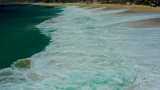 DREAMS LOS CABOS BCS MEXICO-2021: Ocean Waves Rolling Onto Sandy Beach From Above