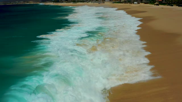 DREAMS LOS CABOS BCS MEXICO-2021: Waves Crashing Onto Golden Sandy Beach