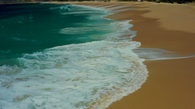 DREAMS LOS CABOS BCS MEXICO-2021: Ocean Waves Rolling Onto Sandy Shore