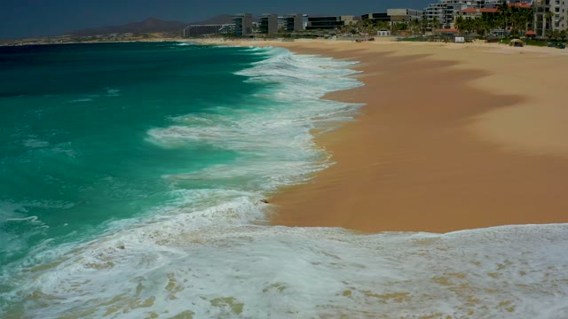 DREAMS LOS CABOS BCS MEXICO-2021: Ocean Waves Rolling Onto Sandy Beach