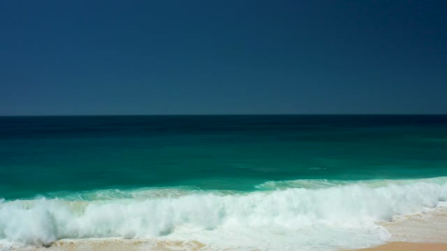 DREAMS LOS CABOS BCS MEXICO-2021: Ocean Waves Crashing on Sandy Shore