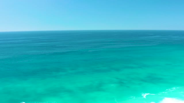 DREAMS LOS CABOS BCS MEXICO-2021: Waves Breaking on Turquoise Ocean Shore