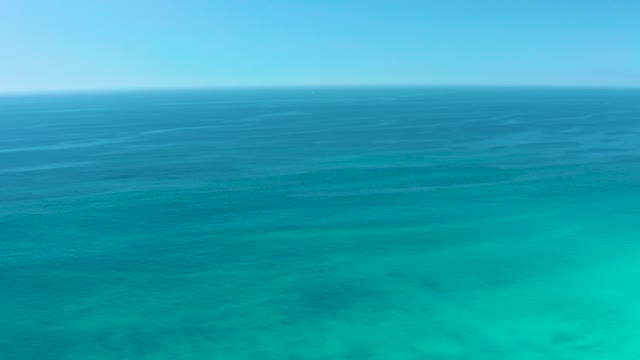 DREAMS LOS CABOS BCS MEXICO-2021: Gentle Waves Over Shallow Turquoise Ocean Waters