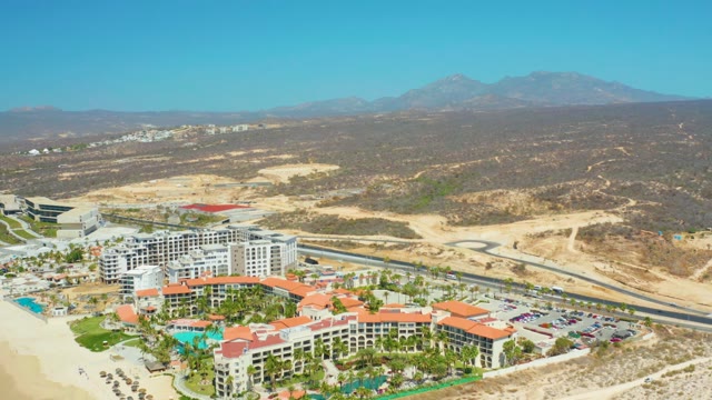 DREAMS LOS CABOS BCS MEXICO-2021: Coastal Resort with Red Roofs and Mountain Backdrop