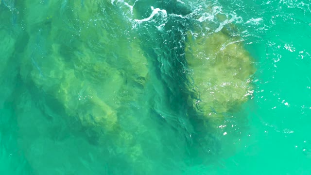 DREAMS LOS CABOS BCS MEXICO-2021: Underwater Rocks in Clear Turquoise Water with Gentle Waves