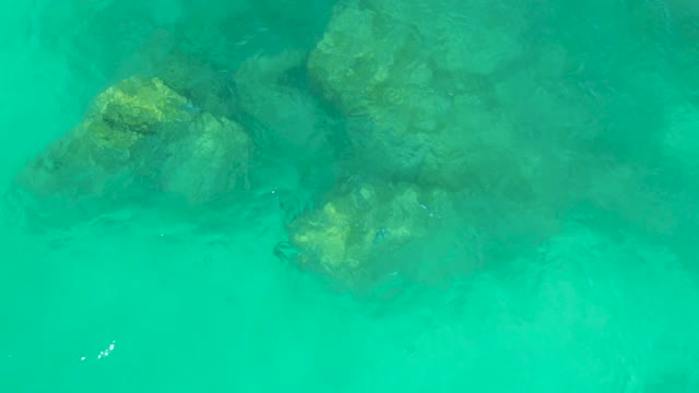 DREAMS LOS CABOS BCS MEXICO-2021: Submerged Rocks in Rippling Turquoise Water