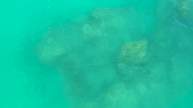 DREAMS LOS CABOS BCS MEXICO-2021: Underwater View of Rocky Seabed in Clear Turquoise Water