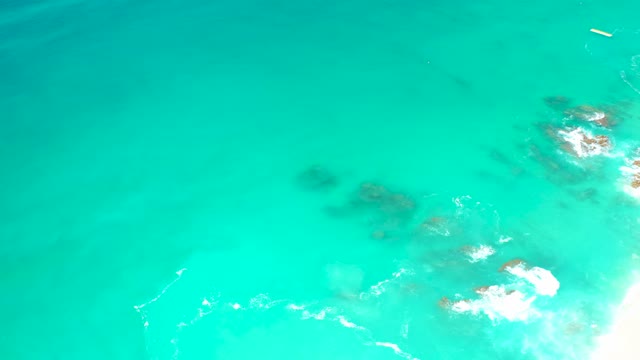 DREAMS LOS CABOS BCS MEXICO-2021: Turquoise Ocean Waves Breaking on Rocky Shore