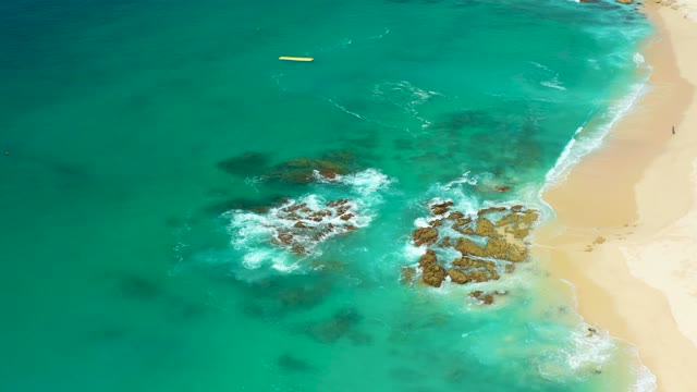 DREAMS LOS CABOS BCS MEXICO-2021: Waves Crashing on Rocky Shore From Aerial View
