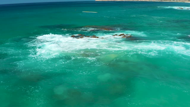DREAMS LOS CABOS BCS MEXICO-2021: Waves Crashing Against Rocky Ocean Shore