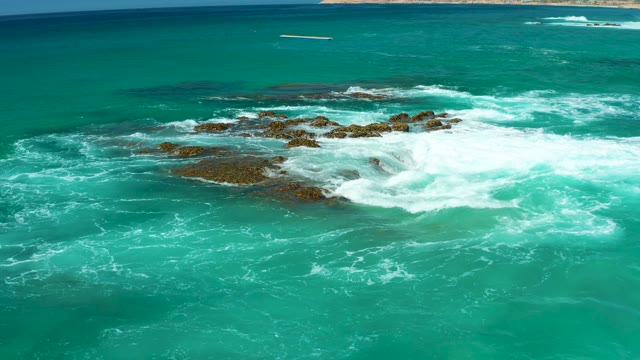 DREAMS LOS CABOS BCS MEXICO-2021: Waves Crashing on Rocky Ocean Shore From Above