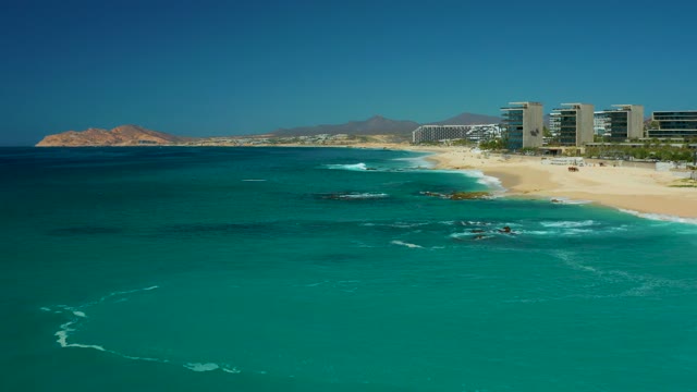 DREAMS LOS CABOS BCS MEXICO-2021: Ocean Waves Breaking on Sandy Shore