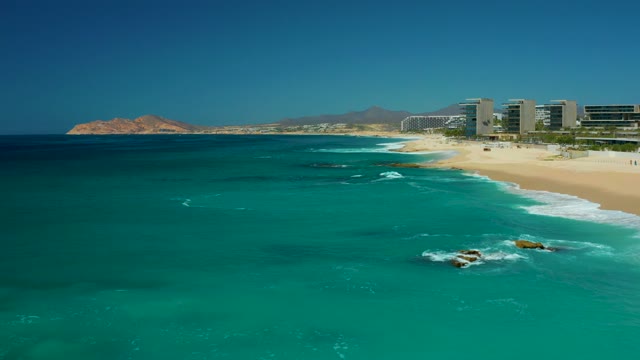 DREAMS LOS CABOS BCS MEXICO-2021: Ocean Waves Rolling Toward Sandy Shore