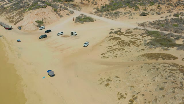 SHIPWRECKS LOS CABOS BCS MEXICO-2021: Sandy Beach with Parked Cars and Moving Tent