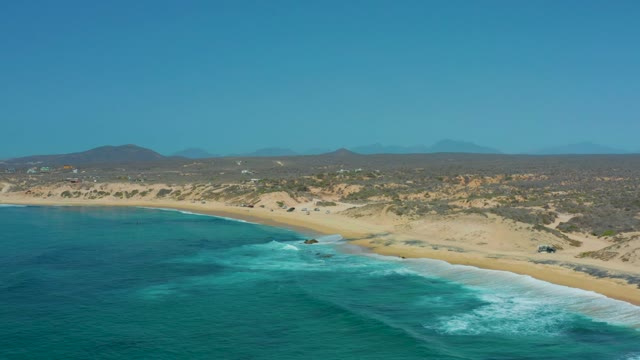 SHIPWRECKS LOS CABOS BCS MEXICO-2021: Waves Approaching Sandy Shore with Coastal Hills