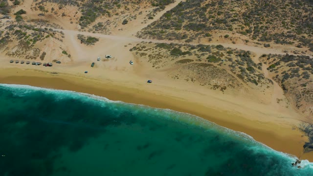 SHIPWRECKS LOS CABOS BCS MEXICO-2021: Vehicles Moving Along Sandy Beach Shoreline