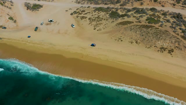 SHIPWRECKS LOS CABOS BCS MEXICO-2021: Vehicles Moving Along Sandy Beach near Ocean