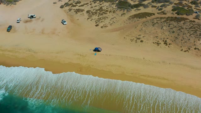 SHIPWRECKS LOS CABOS BCS MEXICO-2021: Waves Rolling on Sandy Beach with Parked Cars