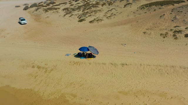 SHIPWRECKS LOS CABOS BCS MEXICO-2021: SUV Driving Past a Desert Campsite