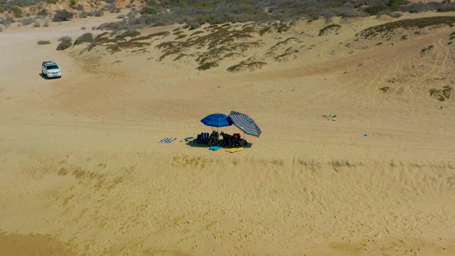 SHIPWRECKS LOS CABOS BCS MEXICO-2021: SUV Driving Past Beach Camp on Sandy Dunes