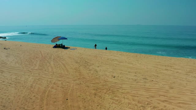 SHIPWRECKS LOS CABOS BCS MEXICO-2021: Beachgoers and Ocean Waves at Sandy Shore
