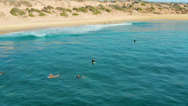 SHIPWRECKS LOS CABOS BCS MEXICO-2021: People Swimming in Calm Ocean Near Sandy Beach