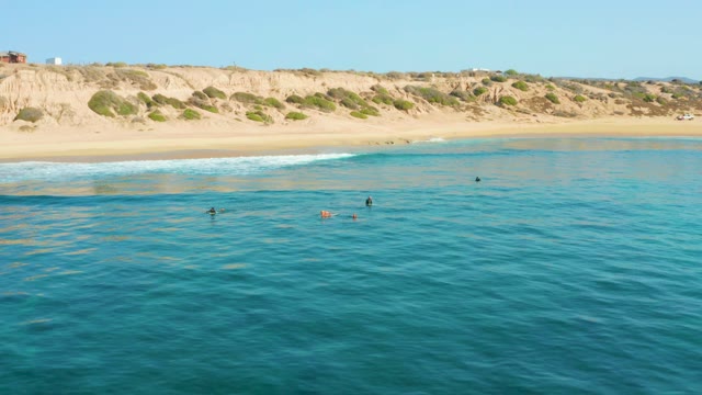 SHIPWRECKS LOS CABOS BCS MEXICO-2021: People Swimming in the Ocean Near a Sandy Beach