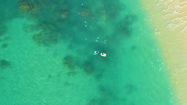 SHIPWRECKS LOS CABOS BCS MEXICO-2021: People Floating in Shallow Turquoise Ocean Water near Sandy Shore