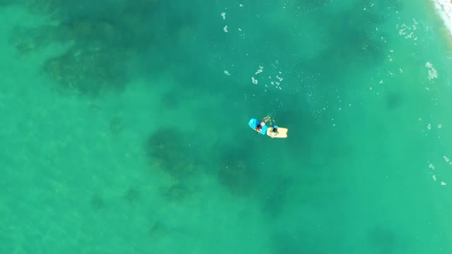 SHIPWRECKS LOS CABOS BCS MEXICO-2021: Person on Float Moving Toward Sandy Shore
