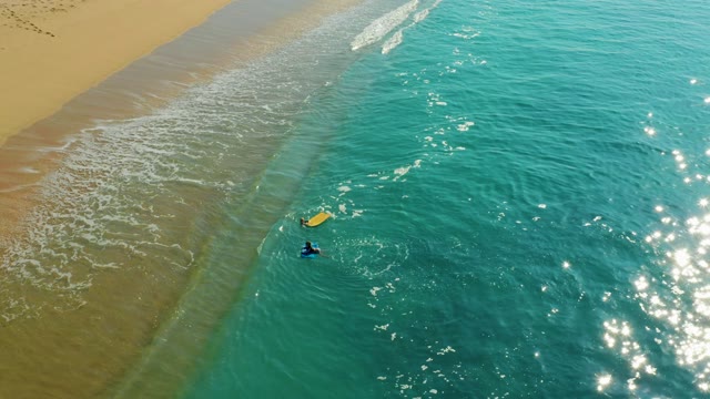 SHIPWRECKS LOS CABOS BCS MEXICO-2021: Surfer with Yellow Board in Shallow Ocean Waves