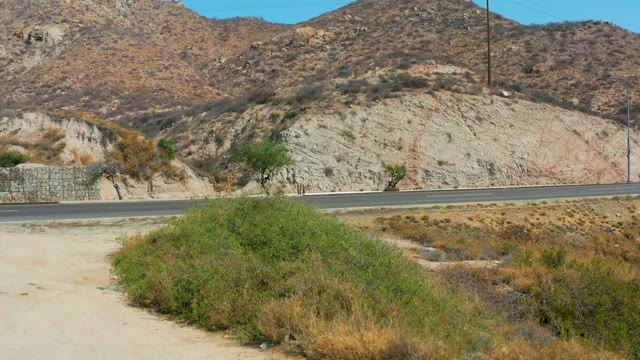 MARQUIS LOS CABOS MEXICO-2021: Vehicles Passing on a Desert Mountain Road
