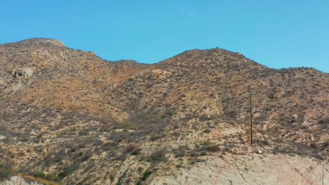 MARQUIS LOS CABOS MEXICO-2021: Arid Mountain Landscape with Moving Sky Object