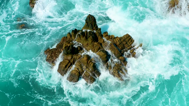 MARQUIS LOS CABOS MEXICO-2021: Waves Crashing Against Rocky Ocean Outcrop