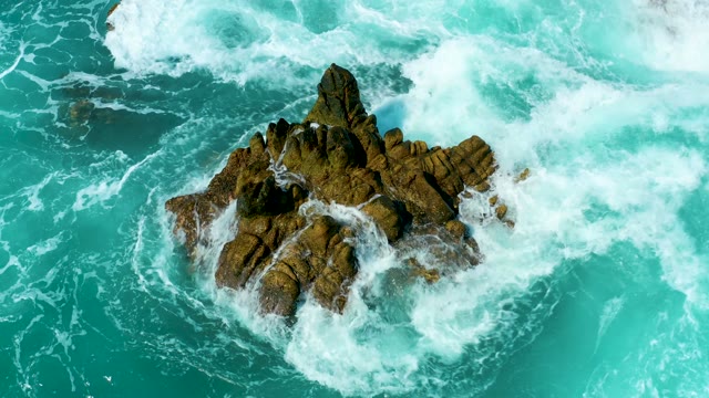 MARQUIS LOS CABOS MEXICO-2021: Rugged Rock Formation in Turquoise Ocean Waves