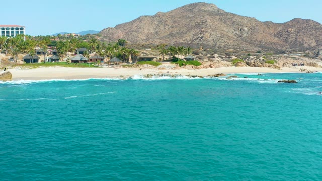 MARQUIS LOS CABOS MEXICO-2021: Gentle Ocean Waves and Beachgoers on Shore