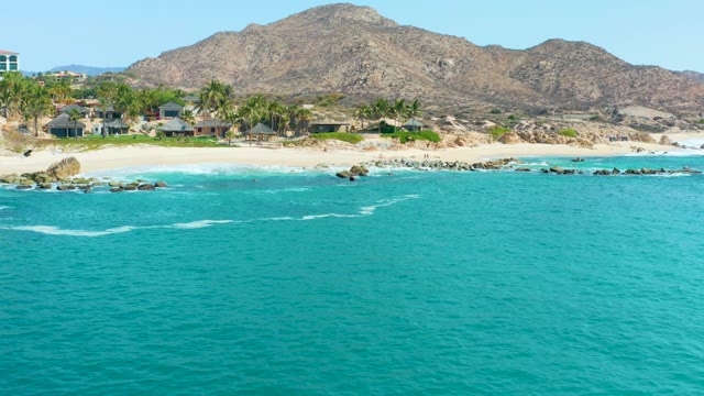 MARQUIS LOS CABOS MEXICO-2021: Coastal Landscape with Rocky Shore and Distant Mountains