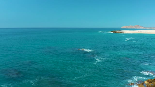 MARQUIS LOS CABOS MEXICO-2021: Waves Crashing Against Rocky Coastline From Above