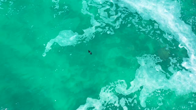 MARQUIS LOS CABOS MEXICO-2021: Person Floating in Clear Turquoise Ocean Waters