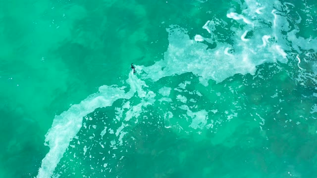 MARQUIS LOS CABOS MEXICO-2021: Bodyboarder Navigating Turquoise Ocean Waves