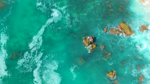 MARQUIS LOS CABOS MEXICO-2021: Waves Splashing on Rocky Ocean Floor