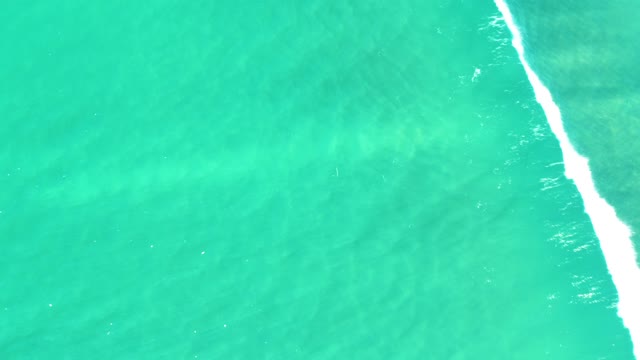 CAMPESTRE SAN JOSE DEL CABO BCS MEXICO-2021: Ocean Waves Receding in Turquoise Water