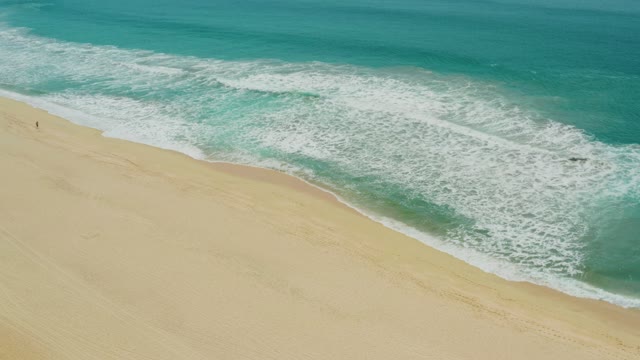 CAMPESTRE SAN JOSE DEL CABO BCS MEXICO-2021: Ocean Waves Rolling Onto Sandy Shore